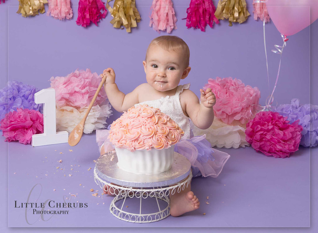 pink and purple cake smash babys first birthday photos cake smash peterborough